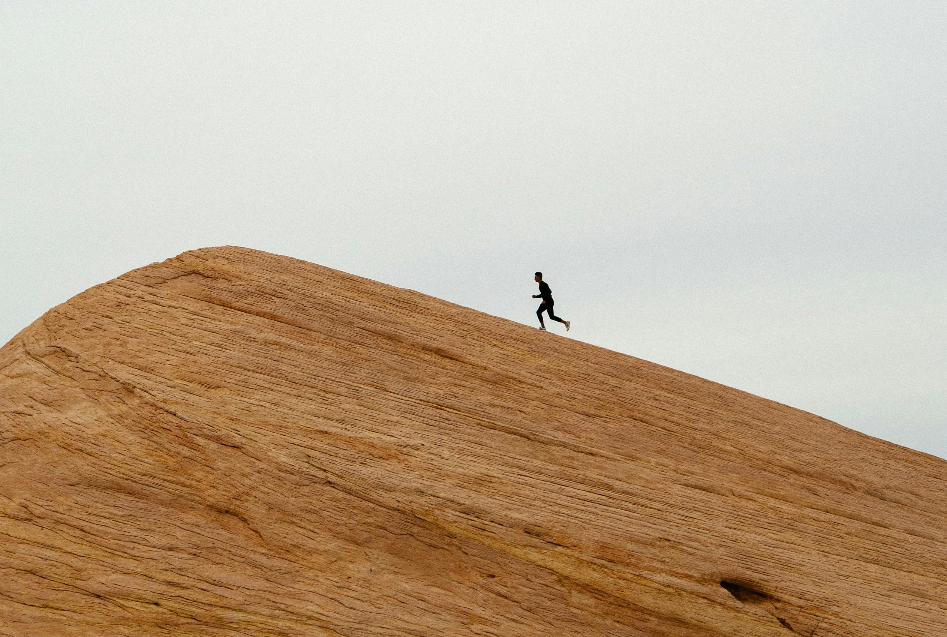 Runner cresting a ridge